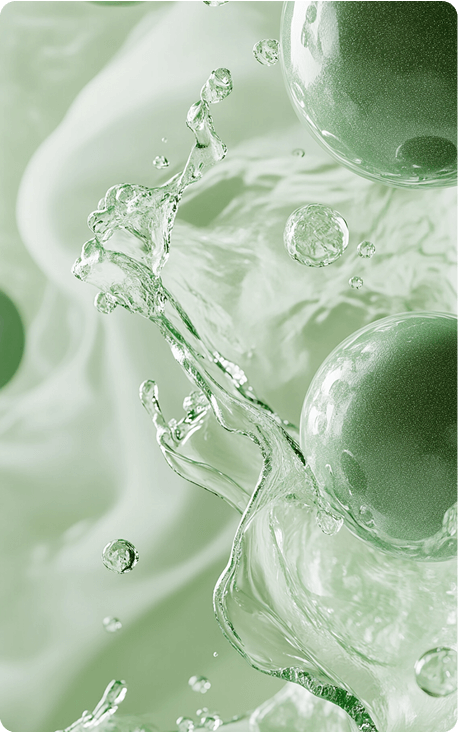 Green spherical objects surrounded by splashes of water and a soft blurred green background.